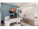 Bright office with a large window, desk, modern decor, and natural light at 4104 N Picadilly Ct, Aurora, CO 80019