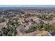 Expansive aerial view of the estate and surrounding neighborhood, showcasing lush landscaping and rolling hills at 7672 S Ensenada Ct, Centennial, CO 80016