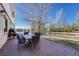 Inviting back deck featuring a dining table and chairs, ideal for outdoor entertaining with scenic views at 7672 S Ensenada Ct, Centennial, CO 80016