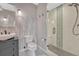 Stylish bathroom featuring a modern vanity, designer tile, and a frameless glass shower enclosure at 7672 S Ensenada Ct, Centennial, CO 80016