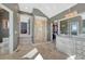 Bathroom featuring vanity, glass shower, and walk-in closet at 7672 S Ensenada Ct, Centennial, CO 80016