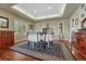 Classic dining room features a round table with a white tablecloth, and large windows at 7672 S Ensenada Ct, Centennial, CO 80016