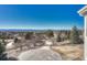 Scenic view of the property's exterior featuring a circular driveway and panoramic mountain views at 7672 S Ensenada Ct, Centennial, CO 80016