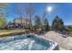 Backyard with a luxurious hot tub, flagstone patio, and landscaping offering a perfect spa-like retreat at 7672 S Ensenada Ct, Centennial, CO 80016