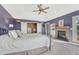 Relaxing main bedroom with fireplace, ample closet space, and neutral color palette at 7672 S Ensenada Ct, Centennial, CO 80016