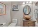 Tastefully decorated powder room with unique sink basin, vanity, and fixtures at 7672 S Ensenada Ct, Centennial, CO 80016