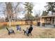 Inviting backyard with a fire pit, trampoline, and covered patio, perfect for outdoor gatherings and relaxation at 6567 S Elizabeth Way, Centennial, CO 80121