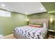 Comfortable bedroom featuring a patterned bedspread and decorative pillows at 6567 S Elizabeth Way, Centennial, CO 80121