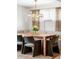 Elegant dining area featuring custom bench seating, a decorative chandelier, and neutral tones at 6567 S Elizabeth Way, Centennial, CO 80121