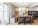 Cozy dining room featuring a built-in bench, stylish chandelier, and natural light at 6567 S Elizabeth Way, Centennial, CO 80121