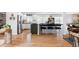 Modern kitchen features an eat-in island with seating and stainless steel appliances at 6567 S Elizabeth Way, Centennial, CO 80121