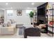 Cozy living room with a large sectional sofa, fireplace, and built-in shelving at 6567 S Elizabeth Way, Centennial, CO 80121