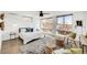 Bright bedroom with modern furniture, large windows, and natural light at 3333 Osage St, Denver, CO 80211
