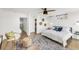 Bright bedroom with ceiling fan, decorative touches, and a large window for natural light at 3333 Osage St, Denver, CO 80211