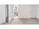 Bedroom featuring carpet, bright lighting, and a view into the attached bathroom at 3333 Osage St, Denver, CO 80211
