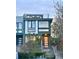 Modern two-story home featuring large windows, a rooftop terrace, and a secure, fenced front yard at 3333 Osage St, Denver, CO 80211