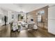 Bright living room with hardwood floors, wood accent wall and stylish furniture, and large windows at 3333 Osage St, Denver, CO 80211
