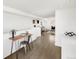 Open-concept living space, with hardwood floors, a workstation and an adjacent area with sofa at 3333 Osage St, Denver, CO 80211