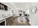Stylish living space with hardwood floors, a bar area, and comfortable seating, creating an inviting ambiance at 3333 Osage St, Denver, CO 80211