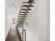 Modern staircase with dark wood steps and metal railing at 3333 Osage St, Denver, CO 80211