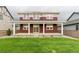 Beautifully landscaped backyard with a covered patio, perfect for outdoor enjoyment at 1826 Hickory Ave, Erie, CO 80516