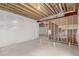Unfinished basement with concrete floor, wrapped walls, and exposed wood ceiling at 1826 Hickory Ave, Erie, CO 80516
