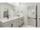 Bathroom with double sinks, stone countertops and tile floors at 1826 Hickory Ave, Erie, CO 80516