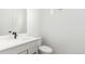 Compact bathroom with a white sink, black faucet and hardware, and a toilet at 1826 Hickory Ave, Erie, CO 80516