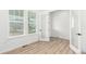 Bright bedroom with hardwood floors, and glass paneled doors at 1826 Hickory Ave, Erie, CO 80516