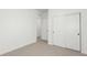 Bedroom features neutral carpet, bright white walls, and double door closet at 1826 Hickory Ave, Erie, CO 80516