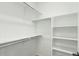 Walk-in closet with built-in shelving, providing ample storage space at 1826 Hickory Ave, Erie, CO 80516