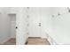 Bright entryway featuring coat hooks, bench seating and a closet for storage at 1826 Hickory Ave, Erie, CO 80516