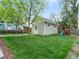 Green backyard featuring mature trees and a play structure, ideal for Gathering fun at 208 N Foote Ave, Lafayette, CO 80026