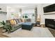 Cozy living room features a comfortable sofa, fireplace, and natural light at 208 N Foote Ave, Lafayette, CO 80026