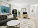 Inviting living room offers a comfortable sofa, stylish decor, and a bright workspace area at 208 N Foote Ave, Lafayette, CO 80026