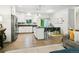 Open-concept living space combines the kitchen, dining area, and living room for a comfortable and modern lifestyle at 208 N Foote Ave, Lafayette, CO 80026