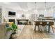 Inviting living space showcasing an open layout connecting the living room and kitchen at 208 N Foote Ave, Lafayette, CO 80026