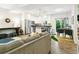 Bright living area with a view of the kitchen, and a dining space with natural light at 208 N Foote Ave, Lafayette, CO 80026