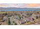 Breathtaking aerial shot of the home's location near a beautiful lake and the mountains at 8900 Iris Ct, Broomfield, CO 80021
