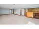 Large basement recreation room with a built in bar area for entertaining at 8900 Iris Ct, Broomfield, CO 80021
