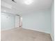 Bright basement featuring neutral walls, lighting, carpet and an open doorway at 8900 Iris Ct, Broomfield, CO 80021