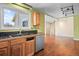Contemporary kitchen showcasing granite countertops, stainless steel appliances, and an open layout at 8900 Iris Ct, Broomfield, CO 80021