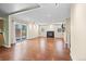 Bright and spacious living room featuring hardwood floors, a cozy fireplace, and sliding door to the patio at 8900 Iris Ct, Broomfield, CO 80021