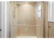 Tiled shower with glass doors at 8900 Iris Ct, Broomfield, CO 80021