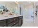 Bathroom features a walk-in shower, double vanity, and modern fixtures at 14099 Deertrack Ln, Parker, CO 80134