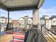 Relaxing outdoor patio with views of neighboring houses and open space on a sunny day at 5738 Urban Ctr, Arvada, CO 80002