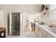 Bright, updated kitchen featuring stainless steel appliances, tile floor and an open concept layout at 321 Fox St, Denver, CO 80223