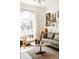 Cozy living room with hardwood floors, large windows, comfortable seating, and stylish decor at 321 Fox St, Denver, CO 80223