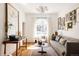 Bright living room showcasing hardwood floors, large windows, modern decor, and comfortable seating at 321 Fox St, Denver, CO 80223