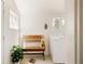 Cozy mudroom featuring a bench, natural light, and laundry area at 321 Fox St, Denver, CO 80223